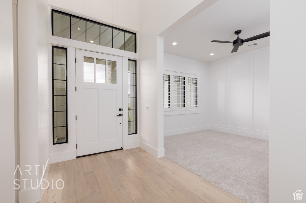 Foyer entrance featuring wood-type flooring, recessed lighting, baseboards, and ceiling fan