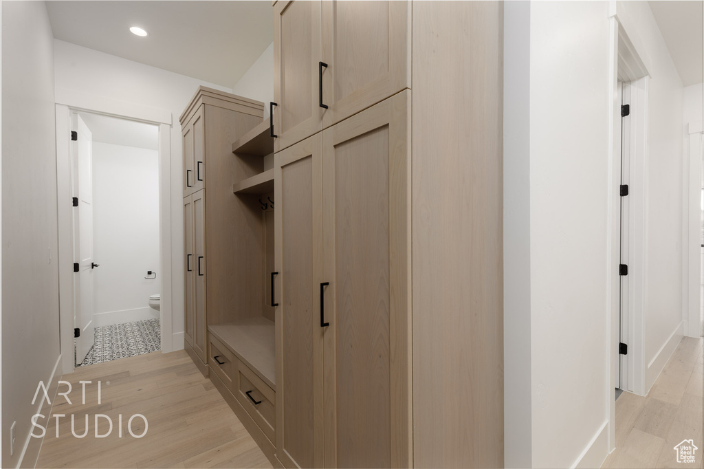 Mudroom with light wood-type flooring, recessed lighting, and baseboards