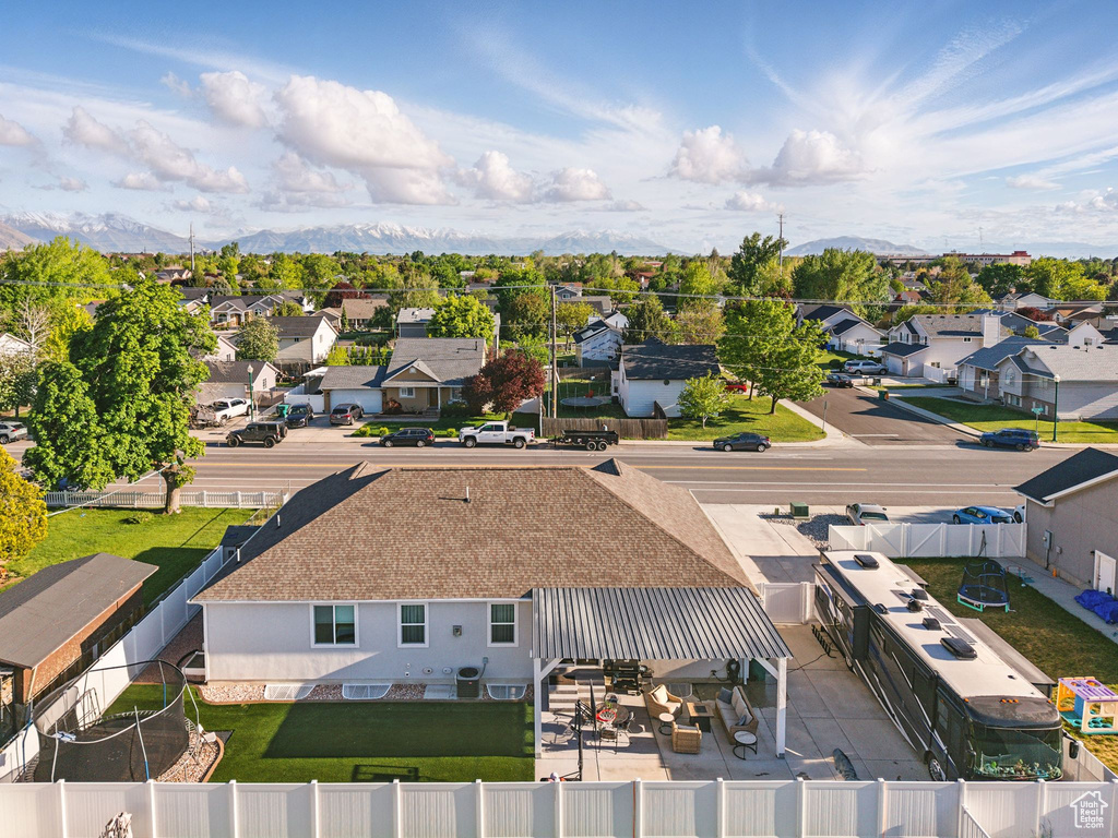 Aerial perspective of suburban area with a mountainous background