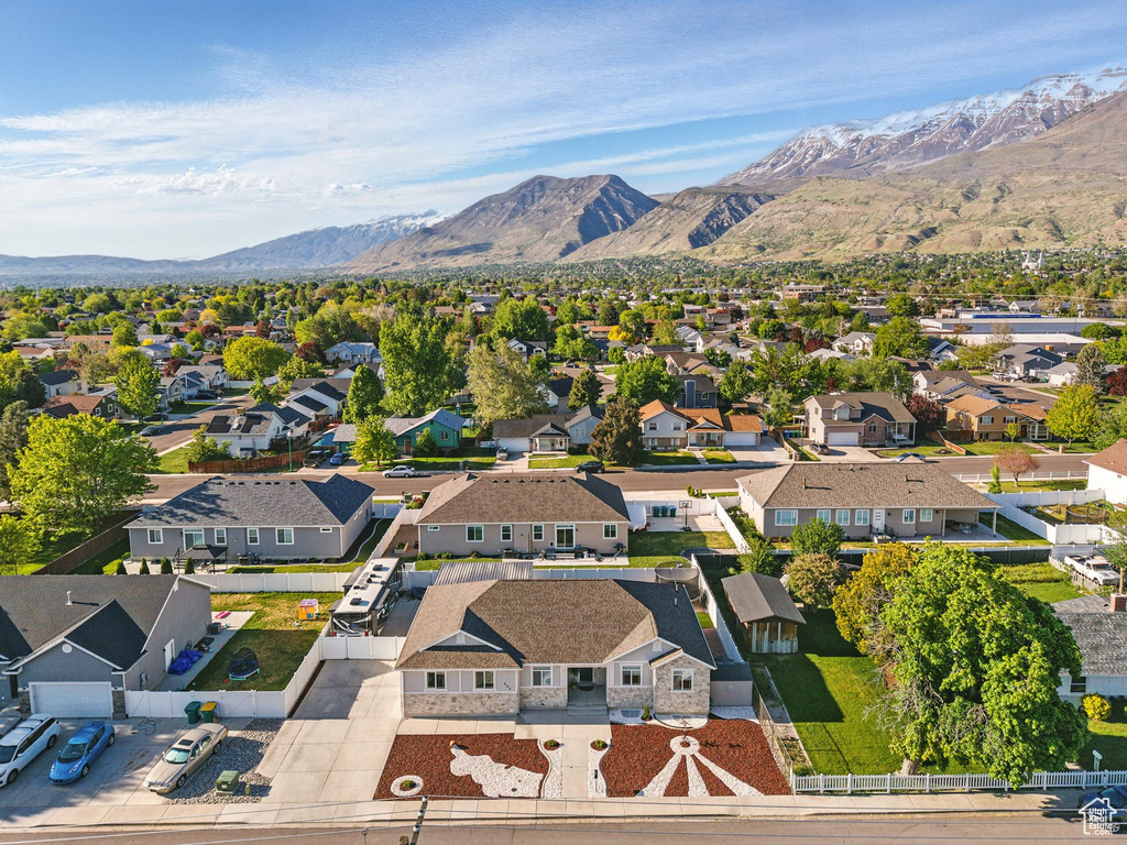 Aerial view of residential area featuring a mountain backdrop