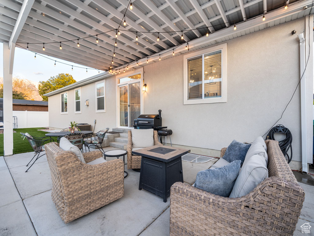View of patio / terrace featuring outdoor dining area, an outdoor hangout area, and fence