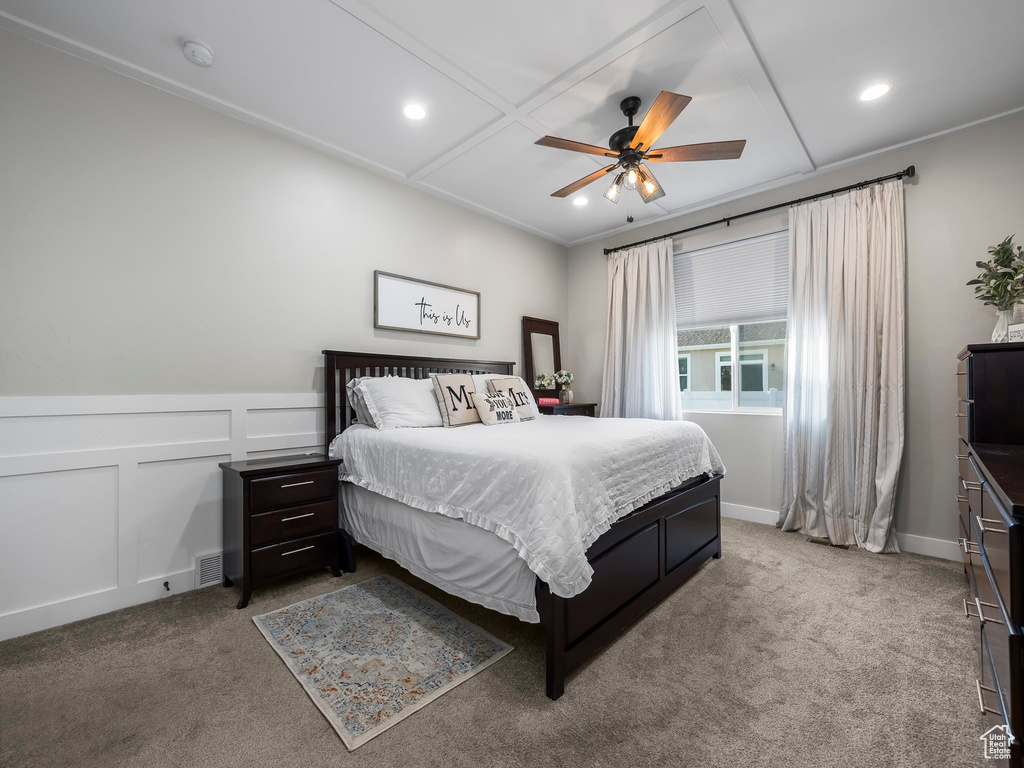 Bedroom featuring carpet floors, a decorative wall, recessed lighting, a ceiling fan, and a wainscoted wall
