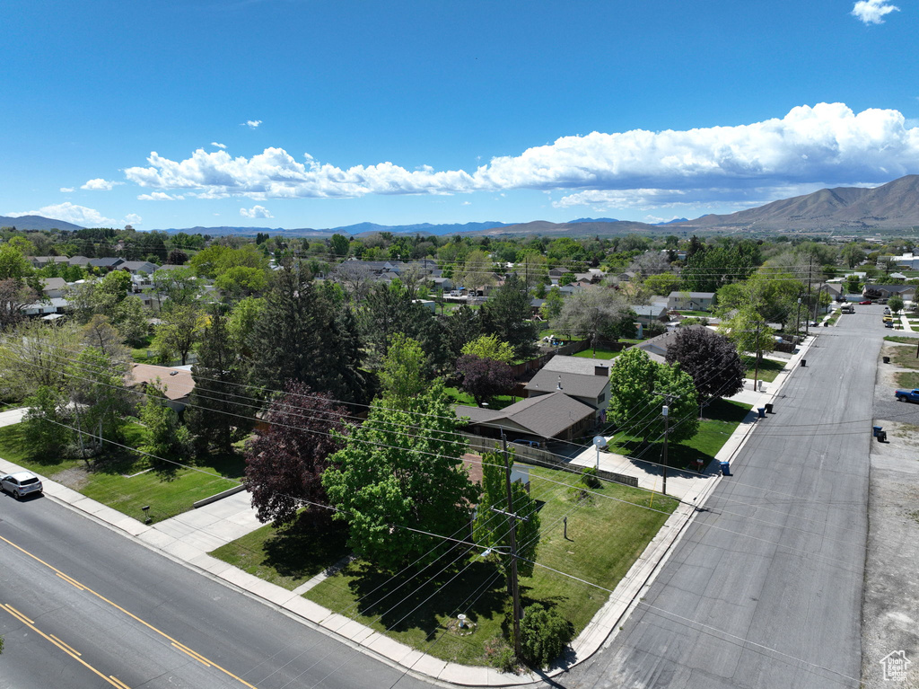 Aerial view of residential area featuring a mountain backdrop
