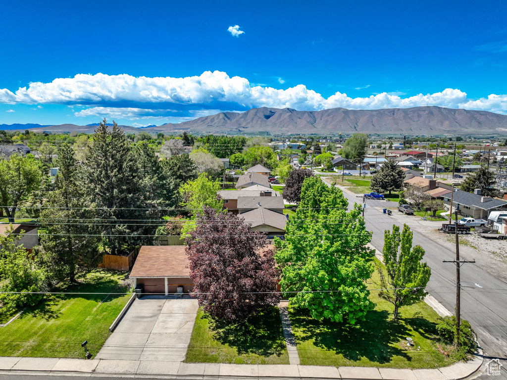 Aerial perspective of suburban area with a mountainous background