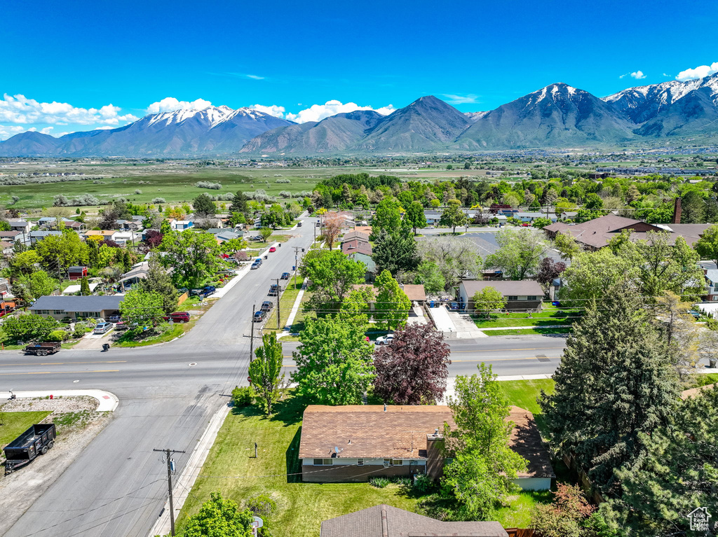 Aerial perspective of suburban area featuring a mountainous background