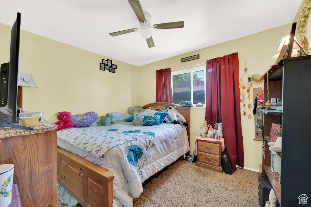 Bedroom featuring carpet flooring and a ceiling fan