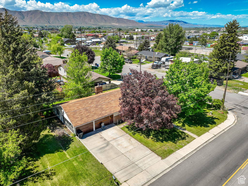Aerial perspective of suburban area featuring a mountainous background