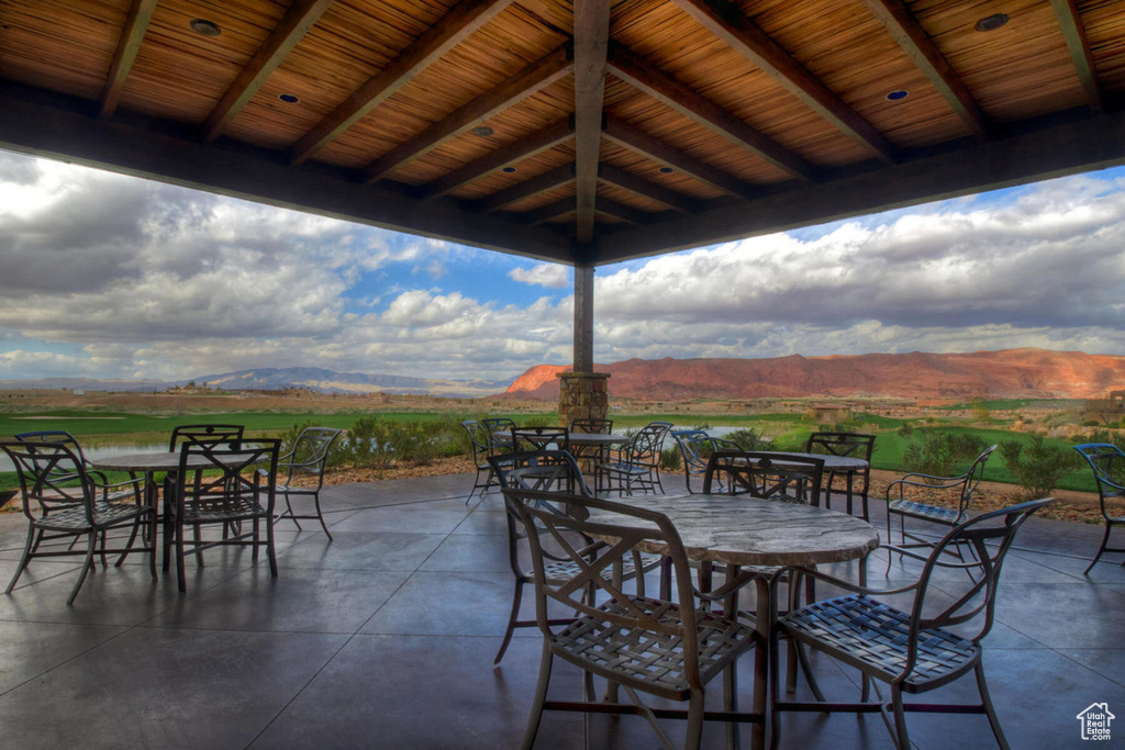 View of patio featuring outdoor dining area and a mountain view