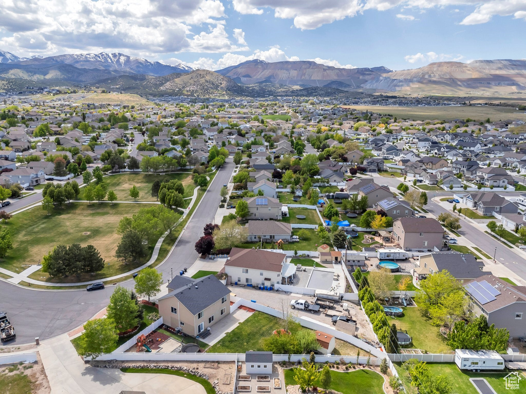 Aerial view of residential area featuring a mountainous background