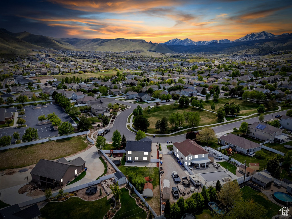 Aerial perspective of suburban area with a mountainous background