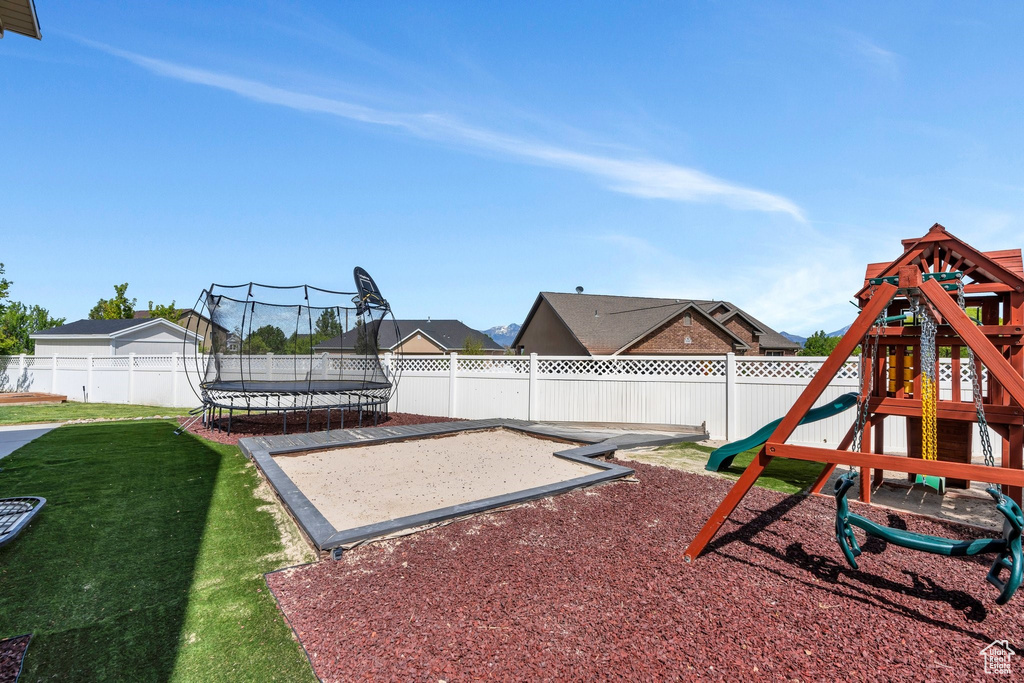 View of play area featuring a trampoline