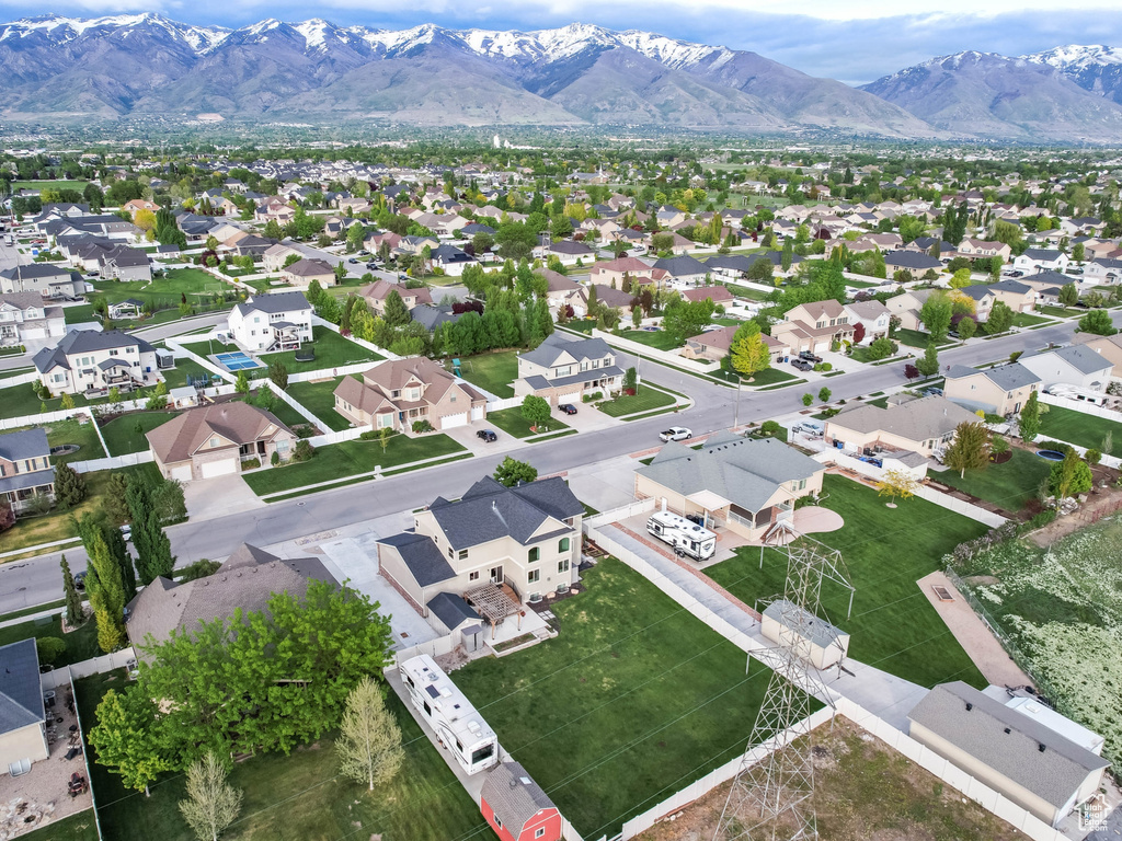 Aerial perspective of suburban area featuring a mountain backdrop