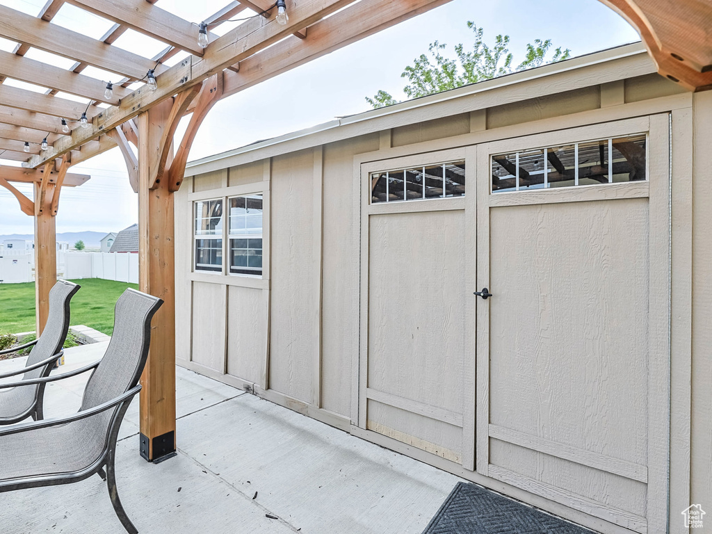 View of shed featuring a pergola