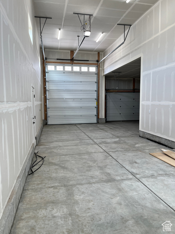 Garage featuring a garage door opener