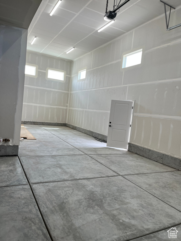 Garage featuring a garage door opener