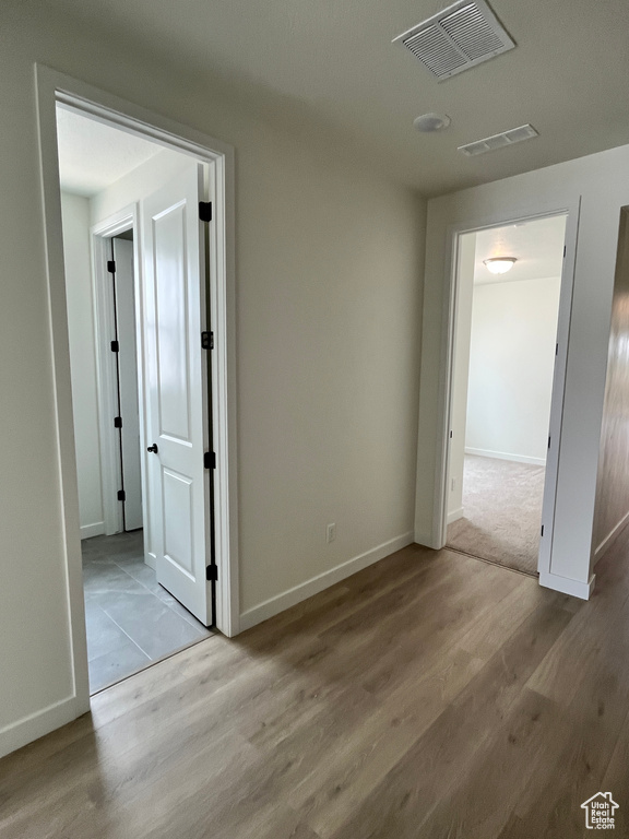 Unfurnished room featuring wood finished floors and baseboards