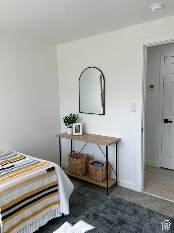Carpeted bedroom featuring baseboards