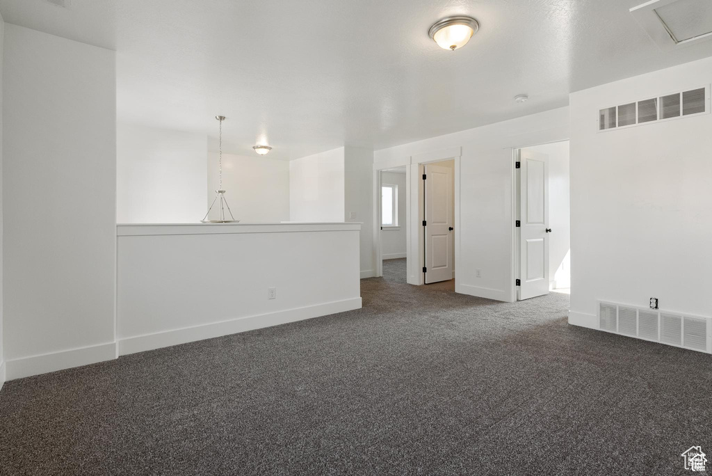 Spare room with carpet floors and baseboards