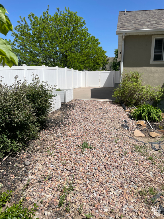 View of yard featuring fence