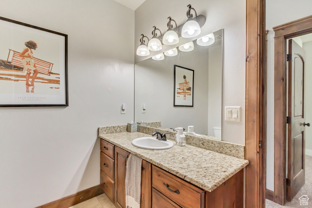 Bathroom featuring baseboards and vanity