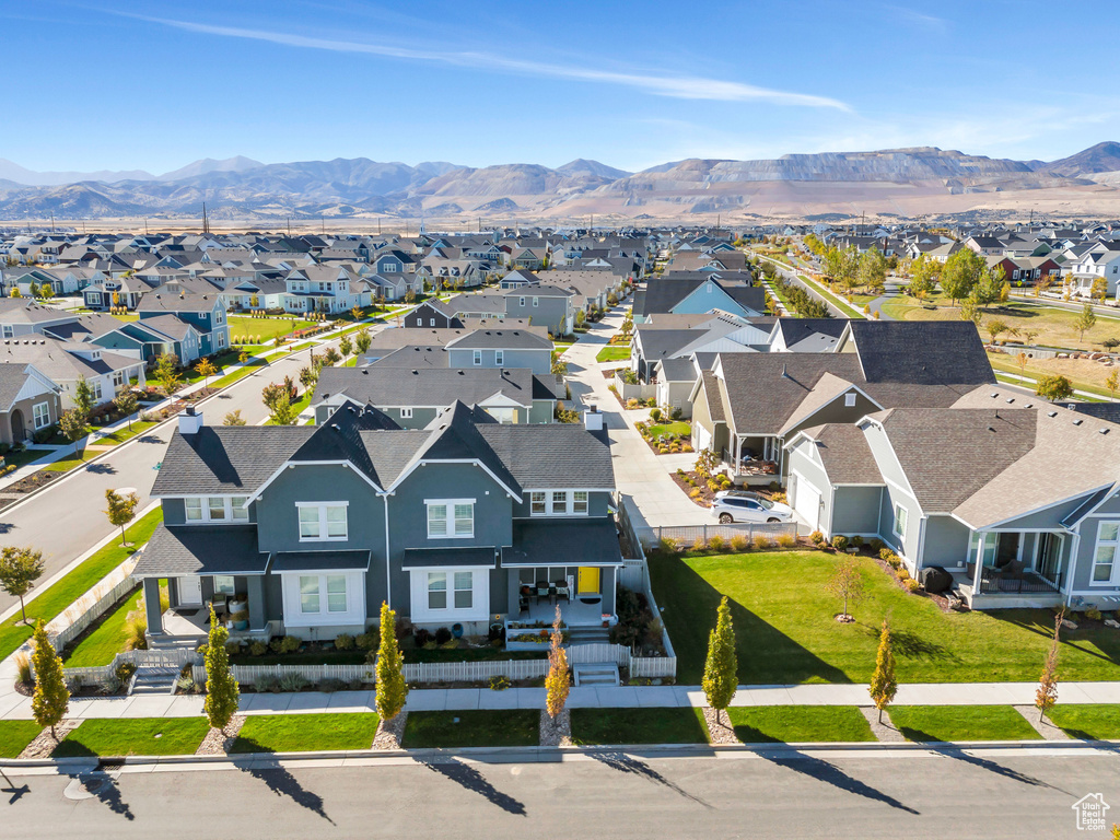 Aerial view of residential area featuring mountains