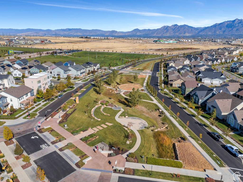 View of property location featuring mountains and nearby suburban area
