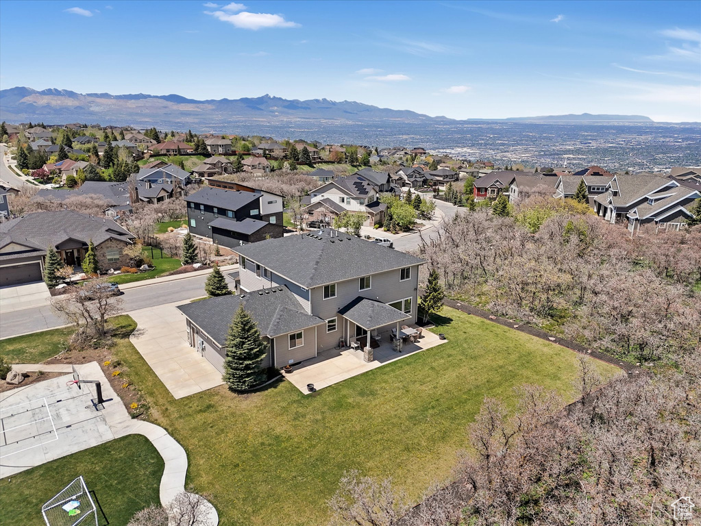 Aerial view of residential area with a mountainous background