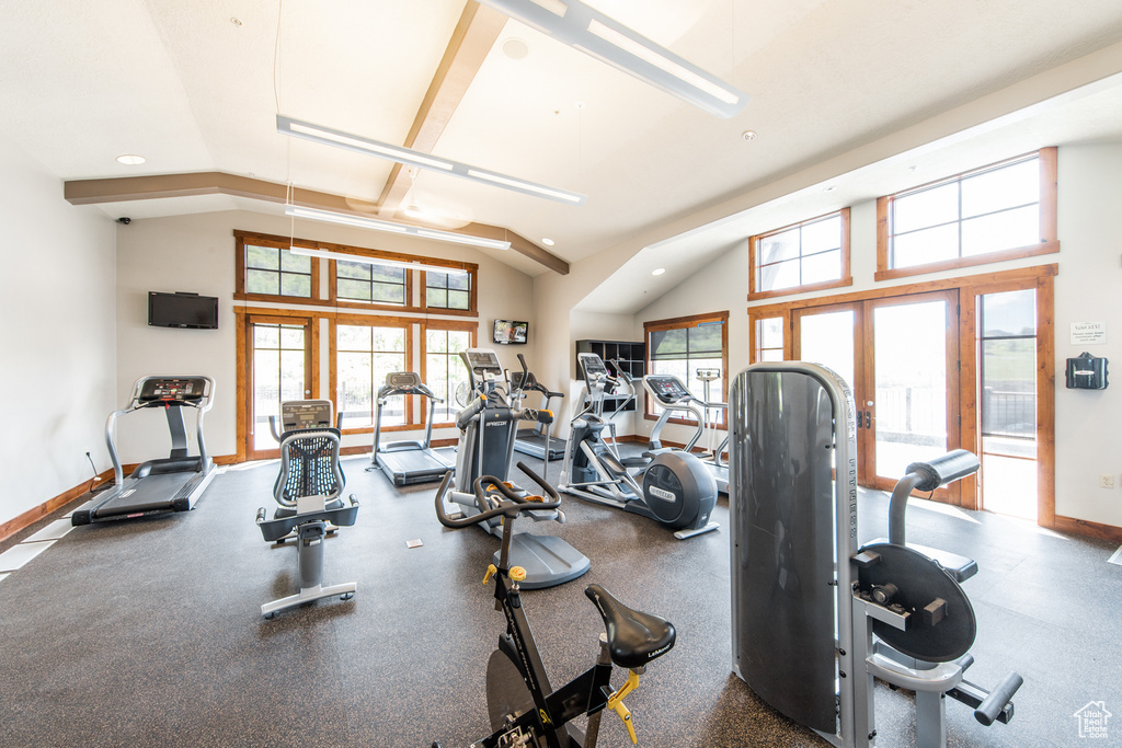 Workout area with recessed lighting, vaulted ceiling, and baseboards