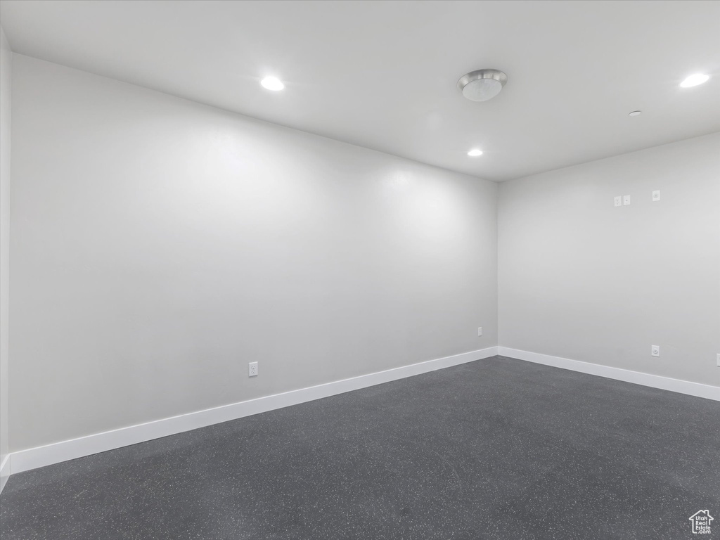 Spare room featuring recessed lighting and baseboards