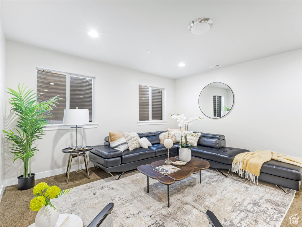 Living room with recessed lighting, baseboards, and carpet floors
