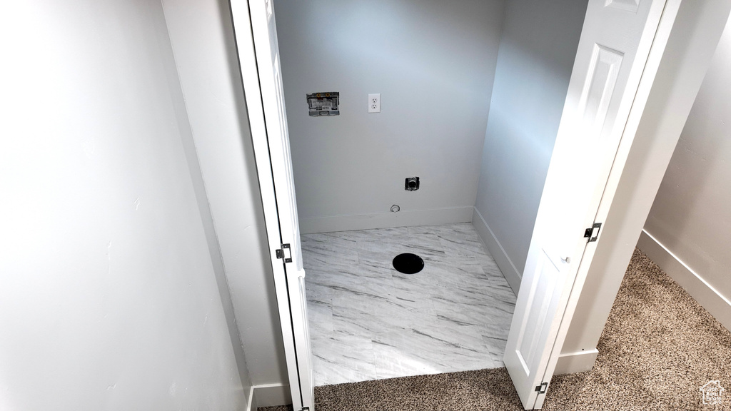 Washroom featuring hookup for an electric dryer and hookup for a washing machine