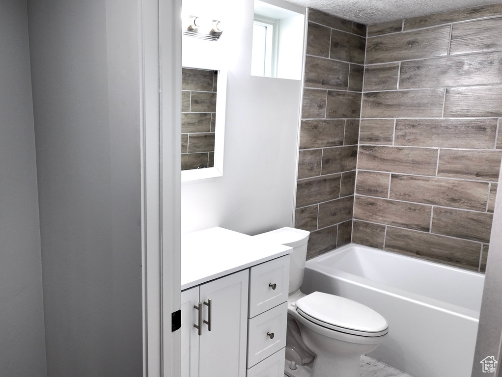 Bathroom featuring vanity and shower / bathtub combination
