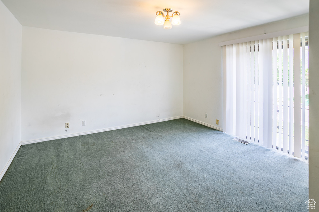 Spare room with carpet flooring and baseboards