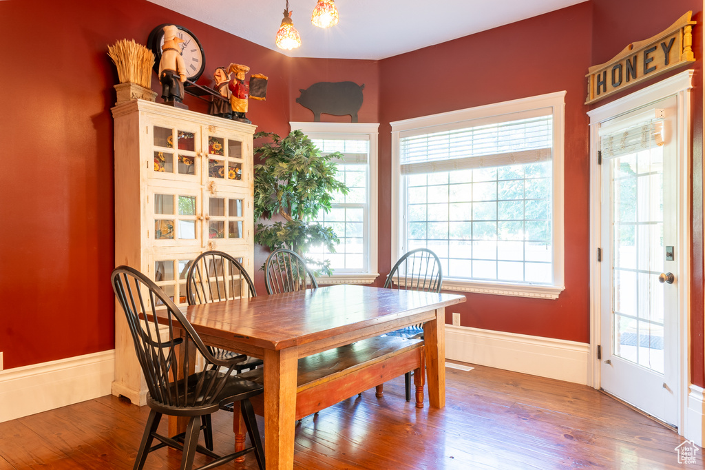 Dining space featuring plenty of natural light and wood finished floors