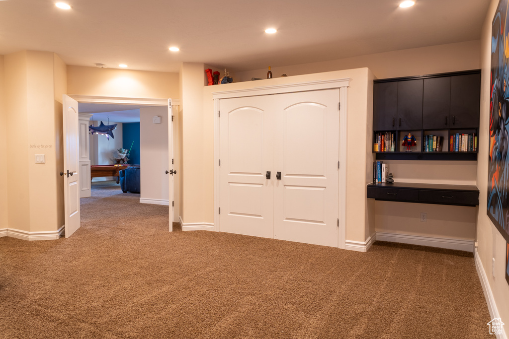Unfurnished bedroom with carpet flooring, a closet, recessed lighting, and baseboards