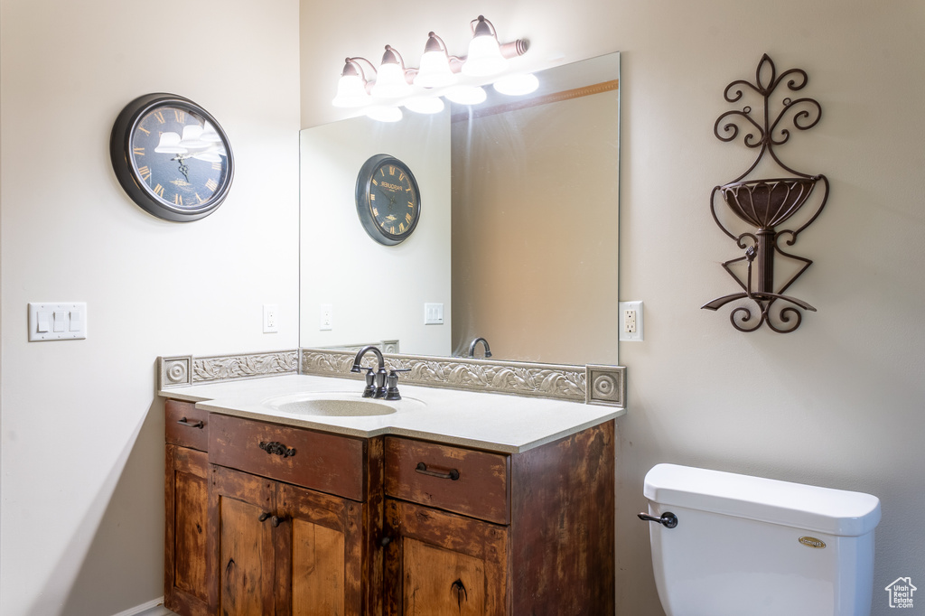 Bathroom featuring vanity and toilet