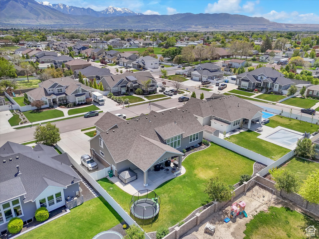 Aerial perspective of suburban area with a mountainous background