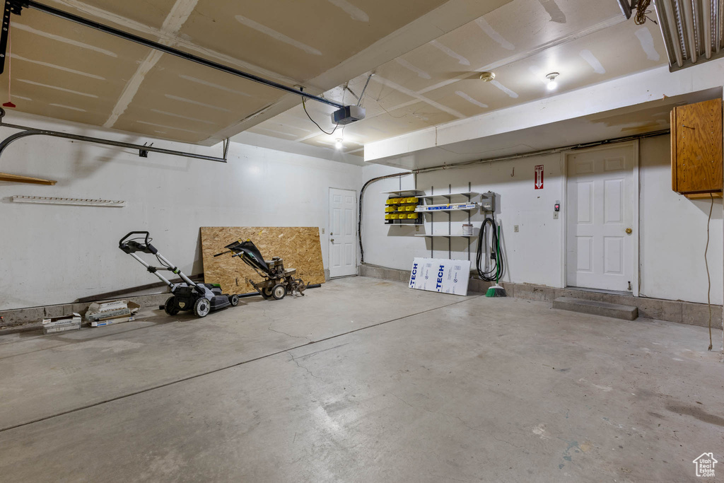 Garage featuring a garage door opener