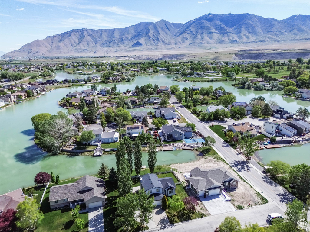 Aerial perspective of suburban area featuring a water and mountain view