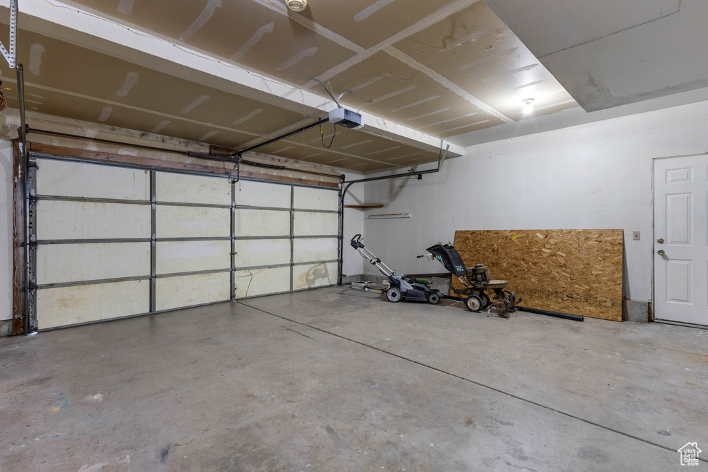 Garage featuring a garage door opener