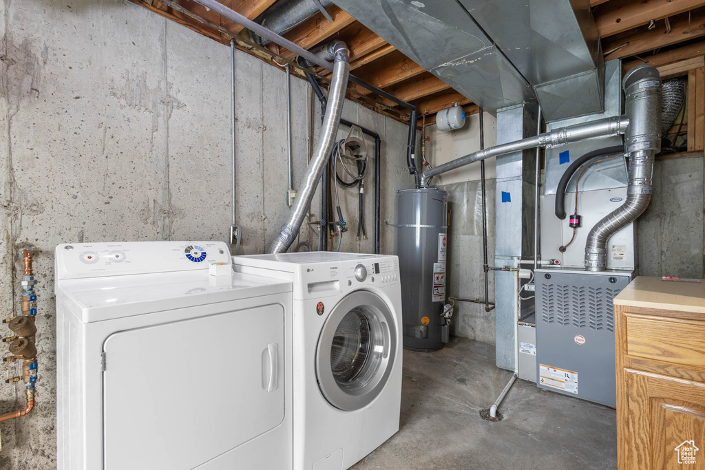 Washroom with gas water heater and washing machine and clothes dryer