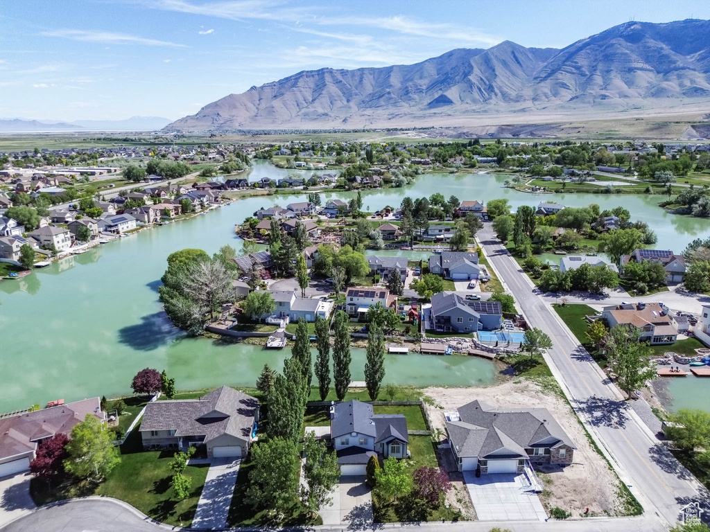 Aerial perspective of suburban area with a water and mountain view