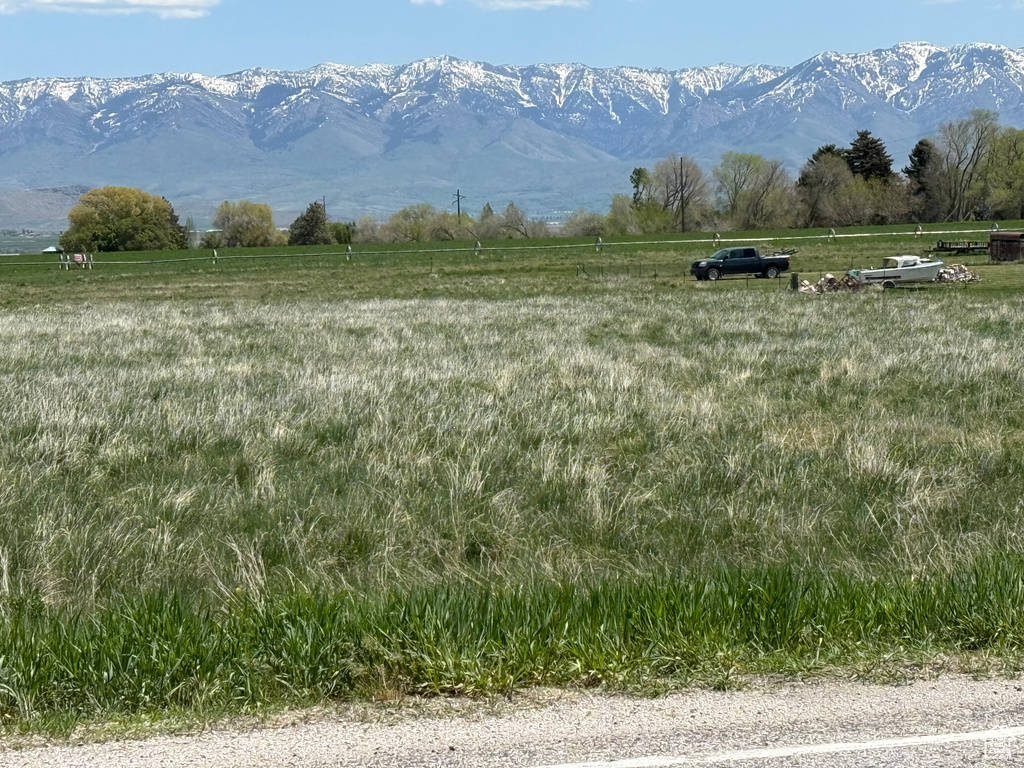 View of mountain backdrop with rural landscape