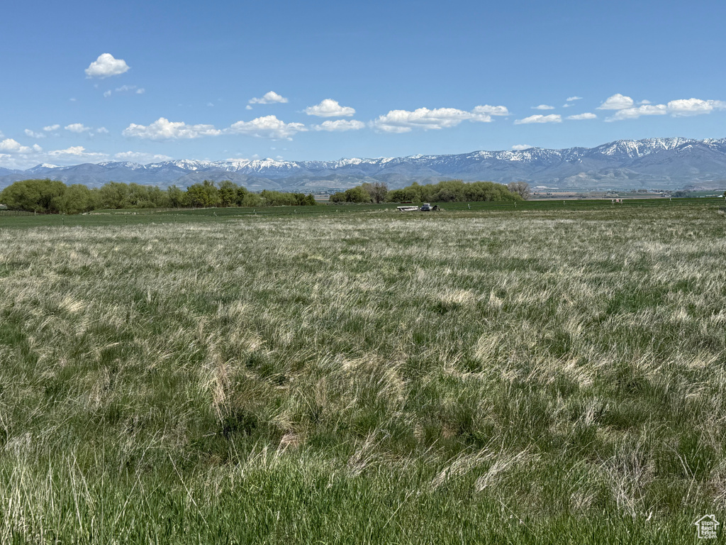 View of undeveloped land with a mountain backdrop and rural landscape