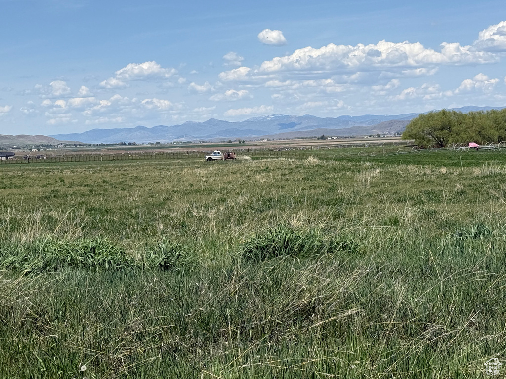View of mountain backdrop featuring rural landscape