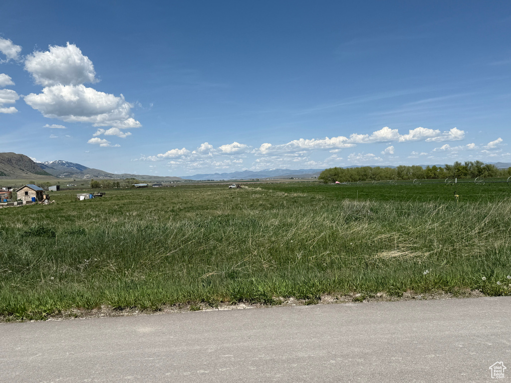 View of local wilderness featuring rural landscape and a mountainous background