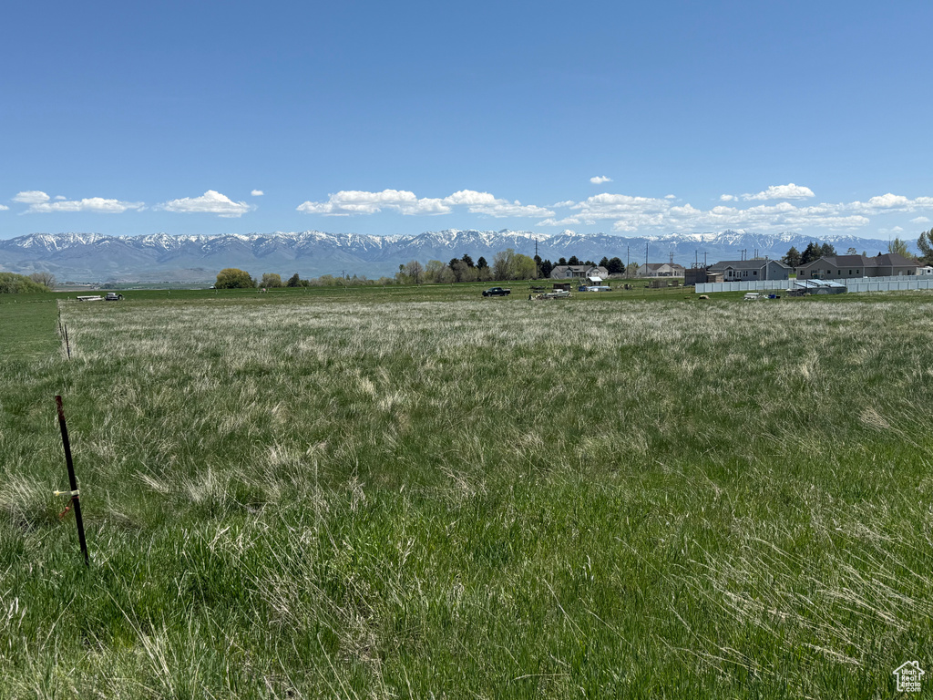 View of mountain background featuring rural landscape