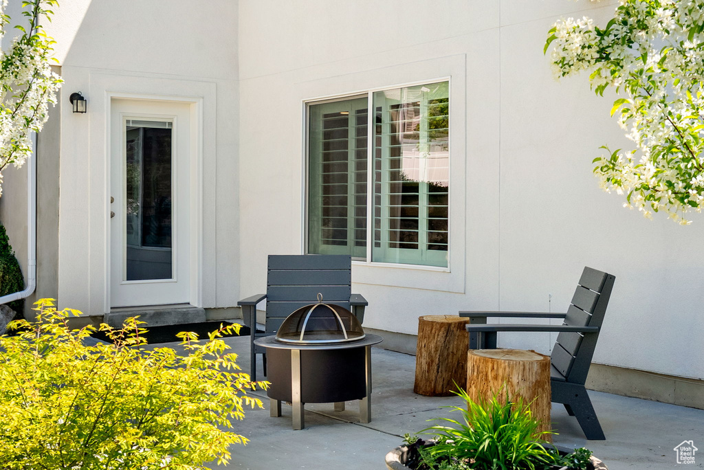 View of patio / terrace with an outdoor fire pit