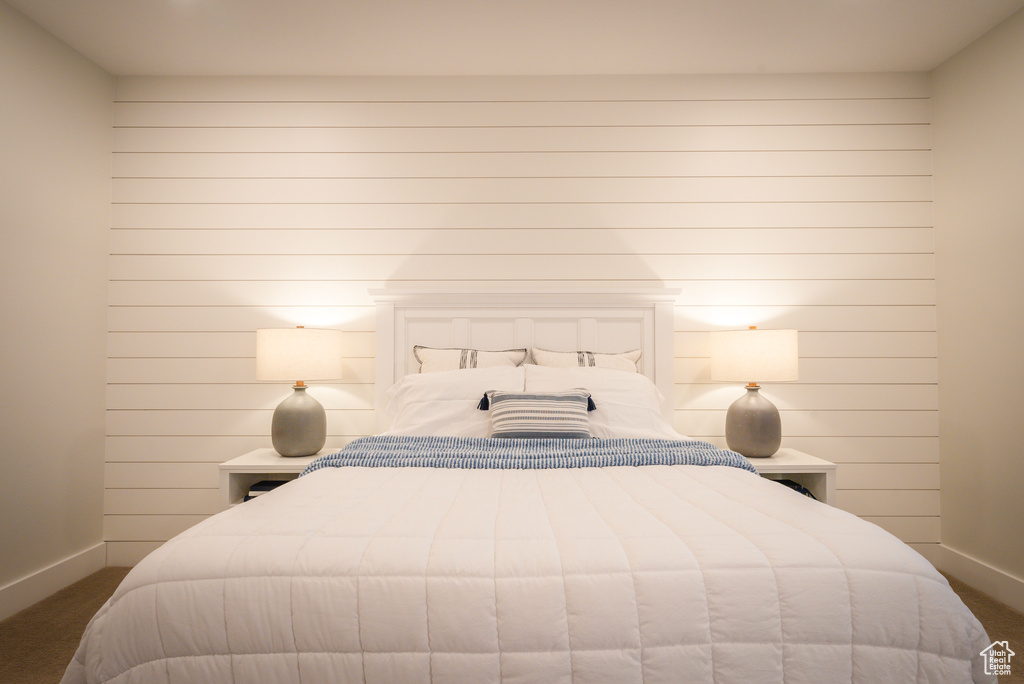Bedroom with baseboards and carpet flooring