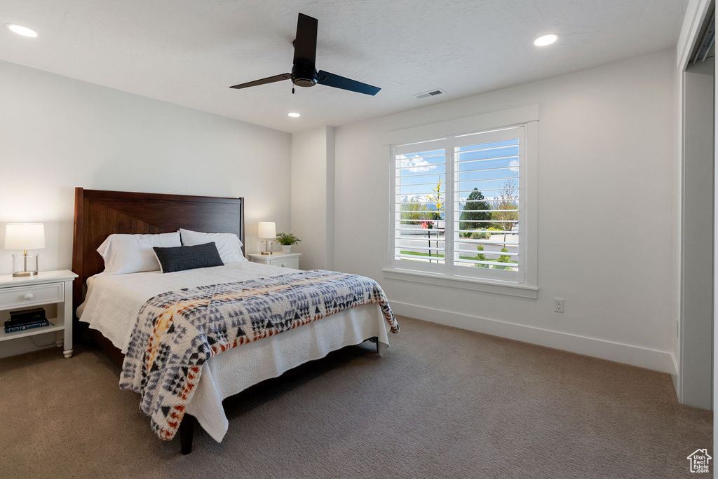 Carpeted bedroom with recessed lighting, ceiling fan, and baseboards